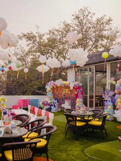 A beautiful My Little Pony themed party setup on our rooftop area, with cloud and rainbow decorations.