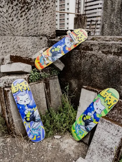 The full collection of Hearty Skateboard decks from our collaboration, displayed in an industrial setting that complements the street art style.