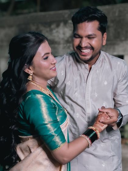 A candid photo of the couple dancing and laughing. Their genuine smiles are a testament to the fun and relaxed atmosphere of our pre-wedding shoots.