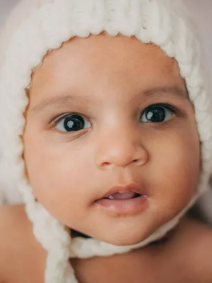 A beautiful close-up of this 4-month-old baby boy. The soft, neutral tones of the boho theme are perfect for highlighting his sweet face.