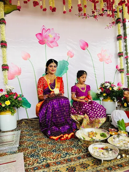 A sweet moment from a Pellikuthuru ceremony. The bride's makeup is kept fresh and simple, allowing her to feel comfortable and beautiful during the rituals.