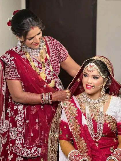A heartwarming moment between the bride and her mother, both looking radiant.