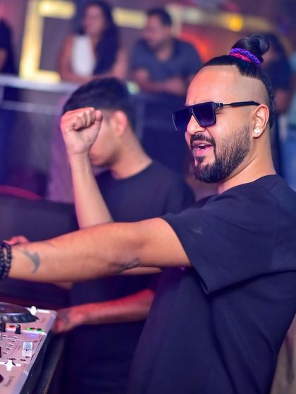 Pumping my fist from the DJ booth at Hydra.