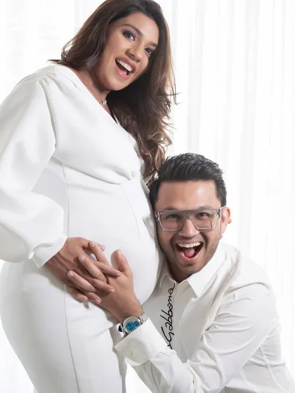 The pure joy of expecting. This all-white studio session captures the fun and excitement between a couple as they await their new arrival. My goal is to make you feel comfortable, so your real personalities shine through.