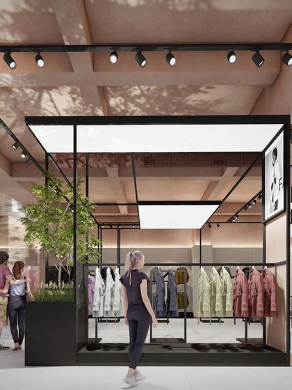 A render for an apparel store in Noida, showing a "shop-in-shop" concept with black metal framing and integrated lighting. The design incorporates planters to bring a touch of nature into the retail environment.