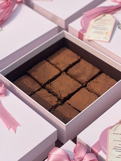 For a first birthday, I created these custom return favors featuring my flourless dark chocolate bars. They are individually boxed and tied with a pink ribbon and a personalized tag.