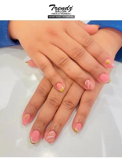 This design combines a soft pink base with elegant gold and white accents. The marble-like swirls add a touch of sophistication, making it a perfect choice for an understated yet unique look.
