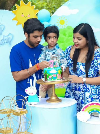 A thrilling 'Dinosaur' themed birthday party, with prehistoric backdrops, dinosaur cutouts, and lush greenery, transporting guests to a Jurassic world.