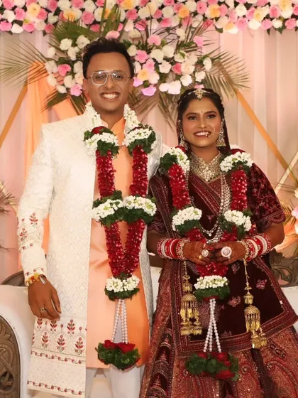 A smiling portrait of the happy couple after the wedding rituals, looking fresh and radiant.