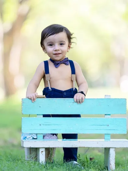 Capturing the dapper and charming side of your little one. Even a simple prop like a park bench can become the perfect stage for a timeless child portrait.