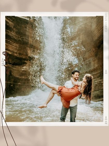 A romantic and playful shot of him lifting her in front of a waterfall, capturing a moment of carefree joy and adventure.