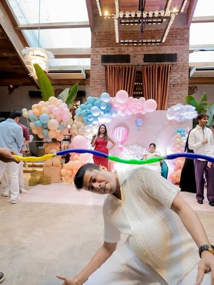 Guests doing the limbo with a balloon. Simple games are often the most fun.