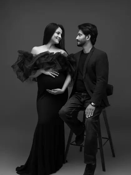 The shared gaze between them is the focus of this intimate black and white portrait.