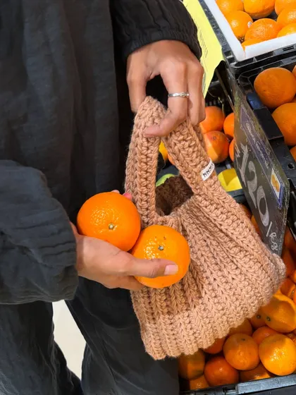 Taking my handmade Japanese knot bag out for a spin at the grocery store. It’s surprisingly spacious and perfect for carrying a few things while keeping your hands free.