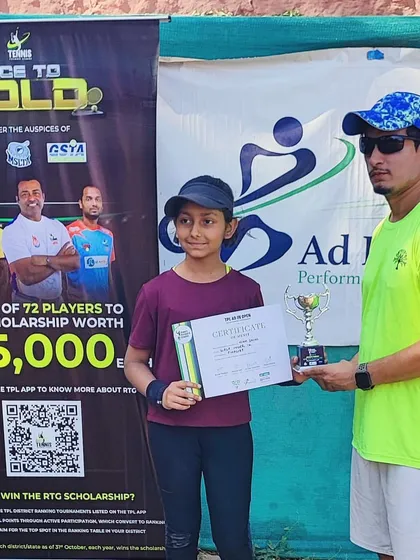 Another one of our promising young players with her runner-up trophy.