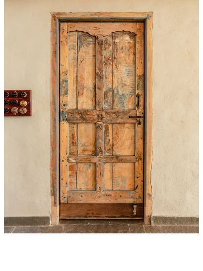 Another view of a favorite distressed door. The layers of paint and time create a unique patina that cannot be replicated, making it a true statement piece.