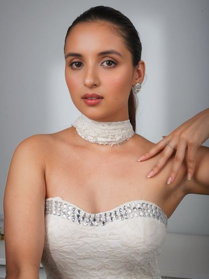 Serving angel energy with this soft glam. The white dress and diamond jewelry are paired with a soft, ethereal makeup look.