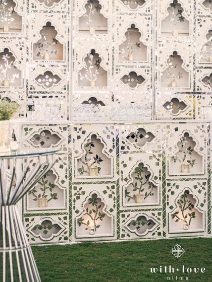 A close-up of the Thikri-paneled bar, showcasing the intricate patterns and reflective beauty. It’s a perfect example of how we blend art with function.