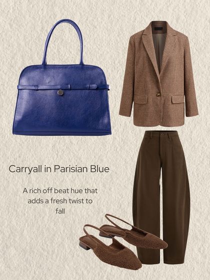 A style guide featuring the Carryall in Parisian Blue. This rich, off-beat hue adds a fresh twist to a fall outfit, pairing beautifully with earthy tones and classic tailoring.