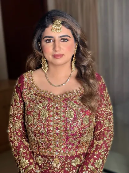 A full-face view of Mariam's look. The makeup is polished and sophisticated, perfect for any special occasion.