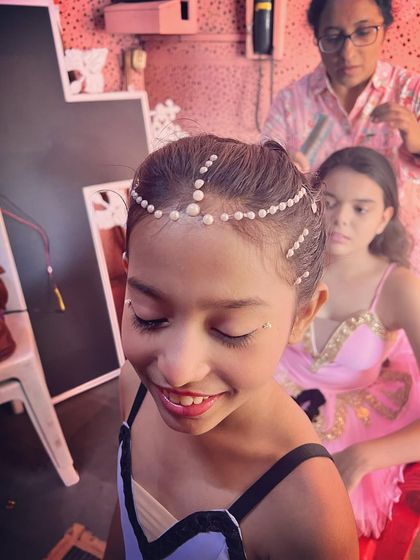 Getting ready backstage. The hair, the makeup, the headpieces are all part of the transformation into a character.