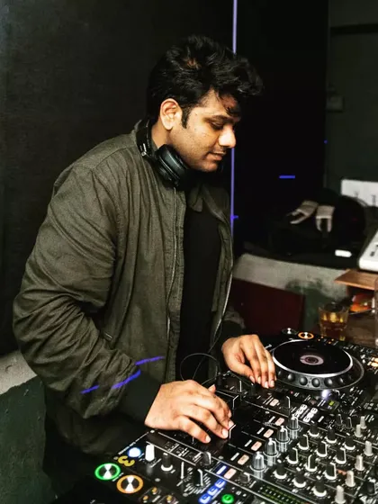 Focused in the zone, mixing tracks at a recent club gig. Every set is about reading the crowd and creating a seamless flow of music that keeps everyone on the dance floor.