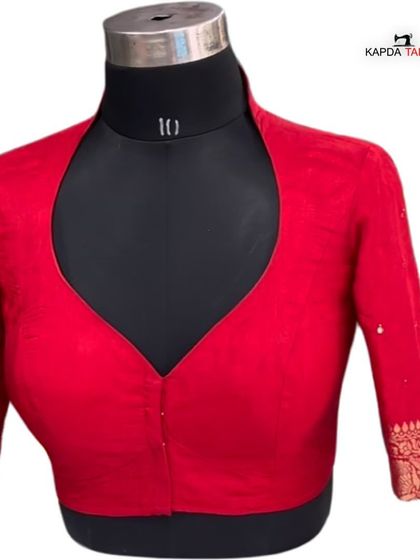 This red blouse with a stylish collar and V-neck cut is another design from my manufacturing portfolio. Contact me to produce your next best-seller.