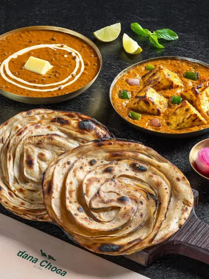 A classic North Indian meal of Dal Makhani and Shahi Paneer served with flaky lachha parathas for Dana Choga.