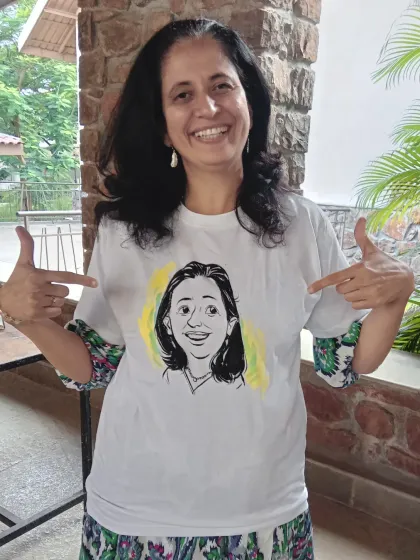 This client is thrilled with her caricature t-shirt. I add a splash of color to make the black-and-white drawing stand out.