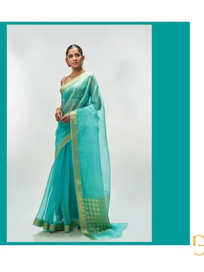 The side profile of the aquamarine saree, a perfect example of the lightweight luxury of the Champa collection.