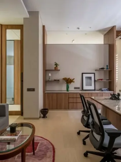 This office blends modern furniture with classic details like wall paneling and traditional art. The result is a timeless and sophisticated space that feels both powerful and comfortable.