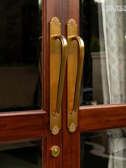 The Agatha Door Pull in a Gold Satin Finish, installed at the Kedia residence. Its elegant, clean lines and subtle detailing on the backplate offer a contemporary take on classic design, blending seamlessly with the home's modern aesthetic.