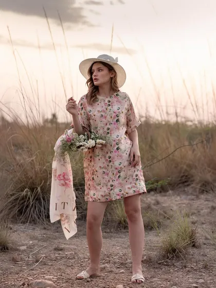 A full-length shot that shows the complete outfit, including the hat, dress, and accessories. This is essential for lookbooks, giving customers a full view of the styled ensemble.