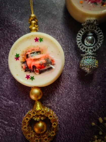A close-up of my handmade Wardrobe Freshener, featuring a cute red truck design. Each piece is thoughtfully crafted to bring a touch of traditional Indian craftsmanship to your modern spaces.