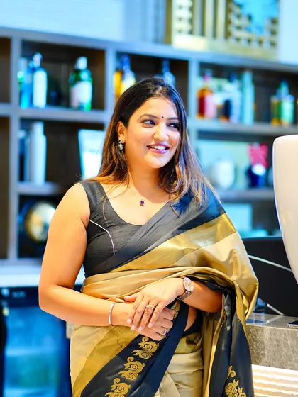 A close-up shot showing my smile and the beautiful texture of the saree.