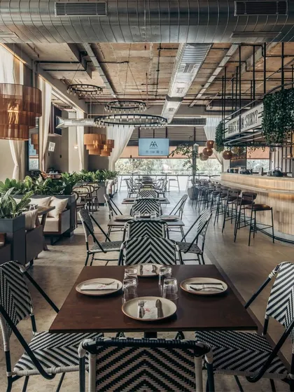Prequel's design uses an open plan layout and high ceilings to create a spacious, lounge style atmosphere. We chose a mix of seating arrangements to accommodate everything from large groups to intimate dinners, ensuring the space feels lively but never crowded.
