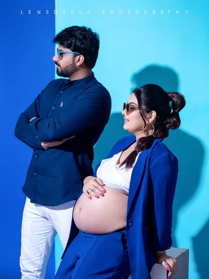 This candid-style shot captures a moment of interaction, adding a dynamic and personal feel to your modern maternity photos.