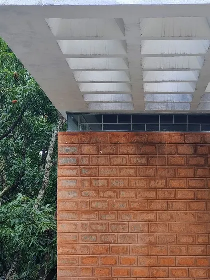 A detail of a coffered slab ceiling and an exposed brick wall at the 'AGA' site.