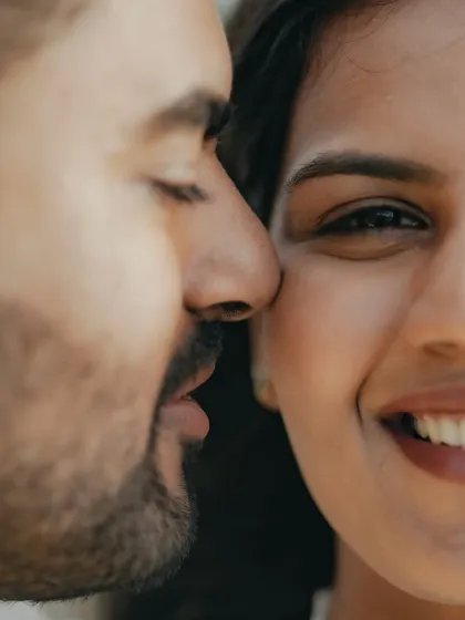 An intimate close-up that captures a quiet, tender moment. This frame focuses on the subtle expressions and closeness that speak volumes about a couple's bond.