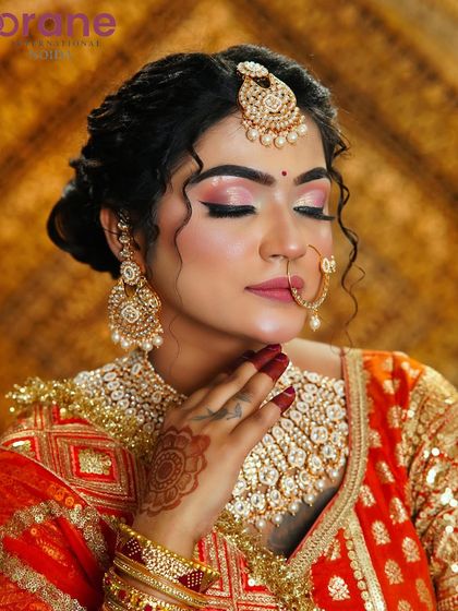 This shot showcases the soft, blended eyeshadow and the delicate details of the bridal look.