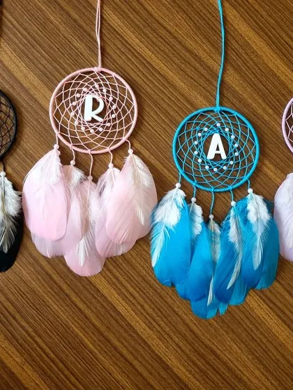 Make it personal with our custom initial dreamcatcher car hangings. Available in a variety of colors, these pieces are a thoughtful way to add a personalized touch of positivity to your travels.