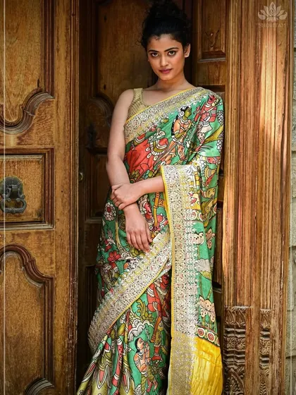 Here is one of my favorite Pen Kalamkari sarees, worn to show its true artistic flair. The fabric becomes a canvas for mythological stories, hand-painted with natural dyes. This saree is a piece of wearable art, blending traditional craft with contemporary style.