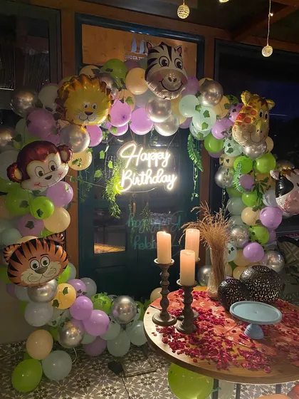 A detailed shot of the jungle animal themed party, showing the candles and table setup.