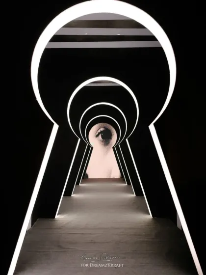 For a sangeet inspired by the artist Yayoi Kusama, we created an immersive experience starting with this grand keyhole entrance. It set the tone for an evening of illusion and artistry, inviting guests into a world where decor becomes a bold statement.