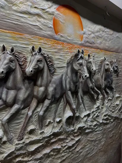 A close-up showing the dynamic poses of the horses in this fibre art piece.