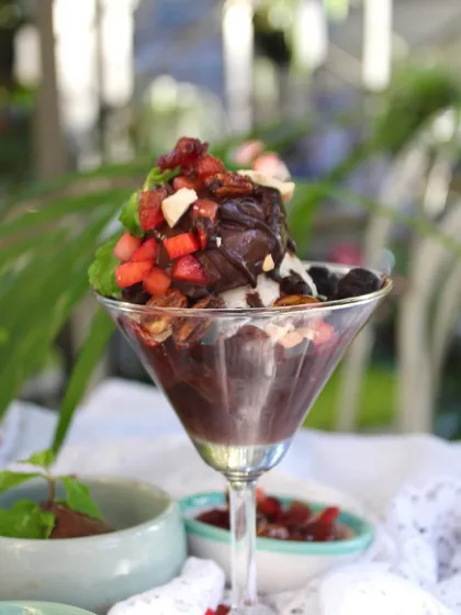 A decadent Chocolate Sundae, loaded with berries and nuts. It's a sinful dessert made completely guilt-free with our in-house, wholesome ingredients.