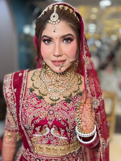 This bride is all smiles, looking absolutely radiant. The makeup enhances her natural beauty, making her look and feel like the best version of herself.