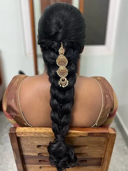 For my client Subha, we created this neat heart braid. It's a unique and beautiful traditional hairstyle that looks stunning with a saree.