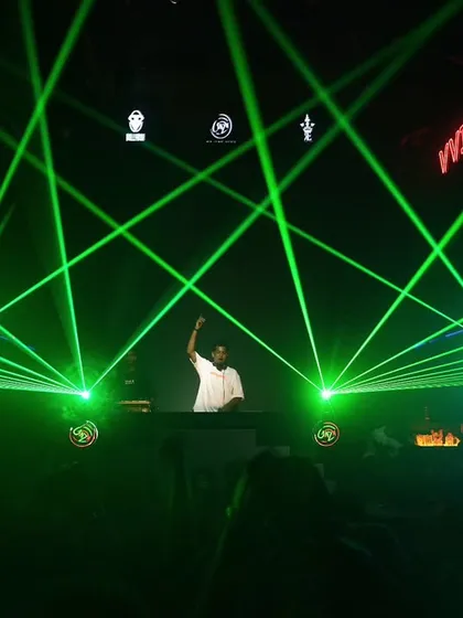 The atmosphere is everything. I work with stunning laser light shows to transform any venue, creating an immersive and high-energy environment for your party.