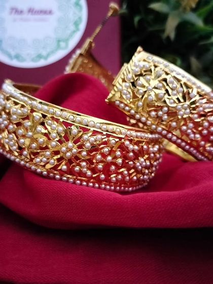 A pair of the 'रातरानी' (Rat-rani) bangles, showcasing their intricate craftsmanship.